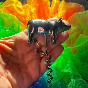 Pure silver vintage pig bottle opener from crate and barrel. Great condition